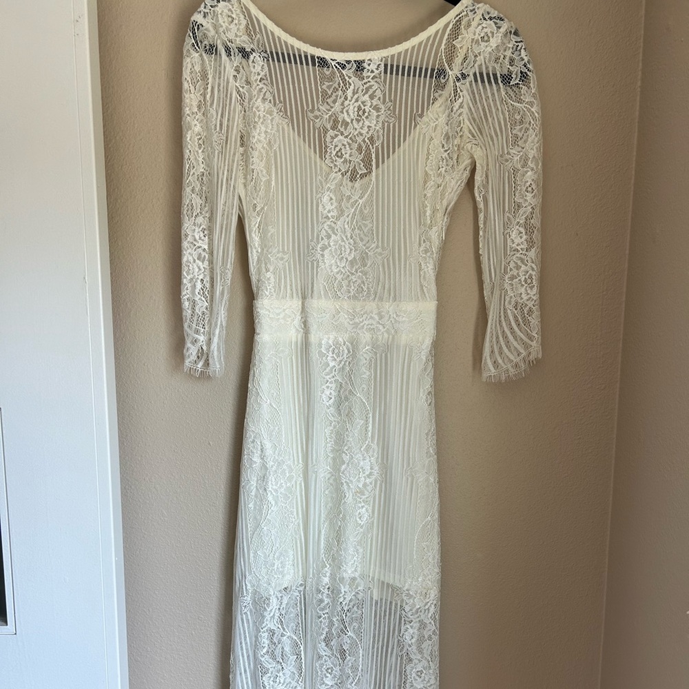 For love and lemons white lace midi dress with open back.